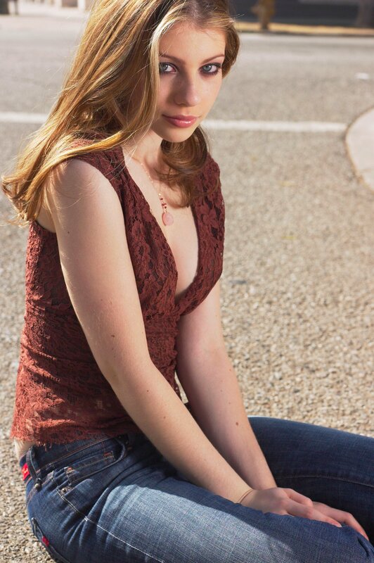 woman in lace top sitting outside