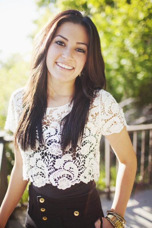 woman in lace top smiling