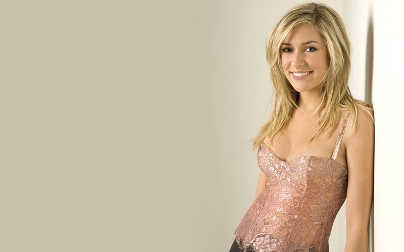 woman in lace top smiling