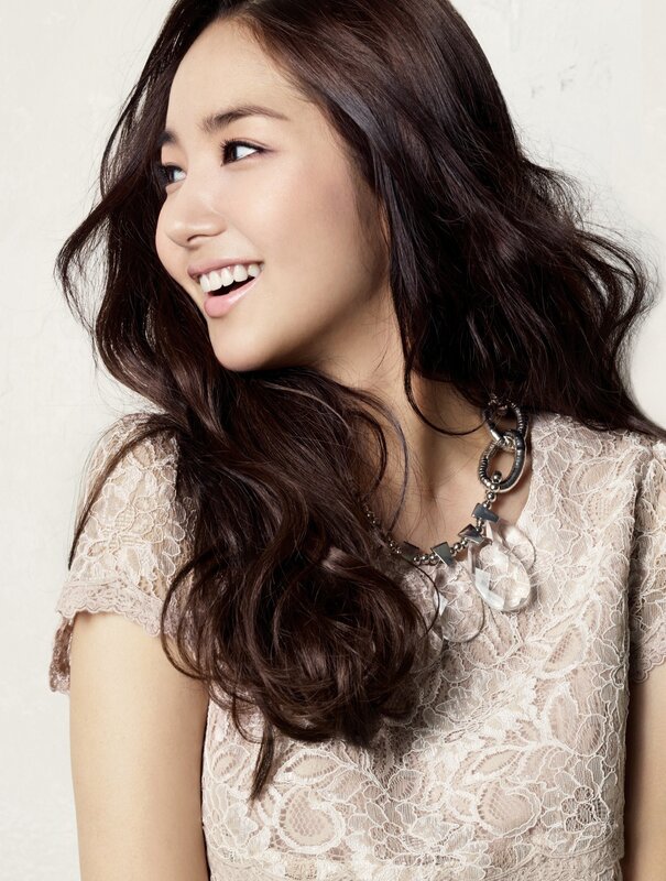 woman in lace top smiling