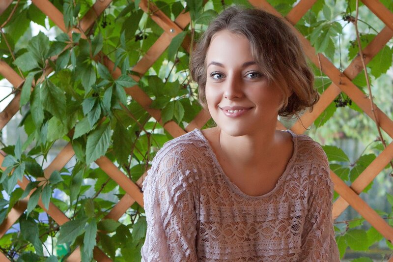 woman in lace top smiling