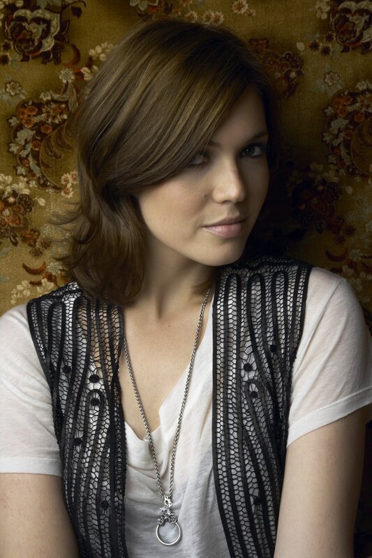 woman in lace vest