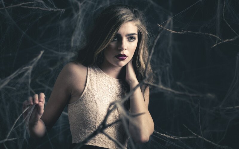 woman in lace with spiderwebs
