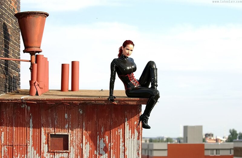 Woman in latex on rooftop