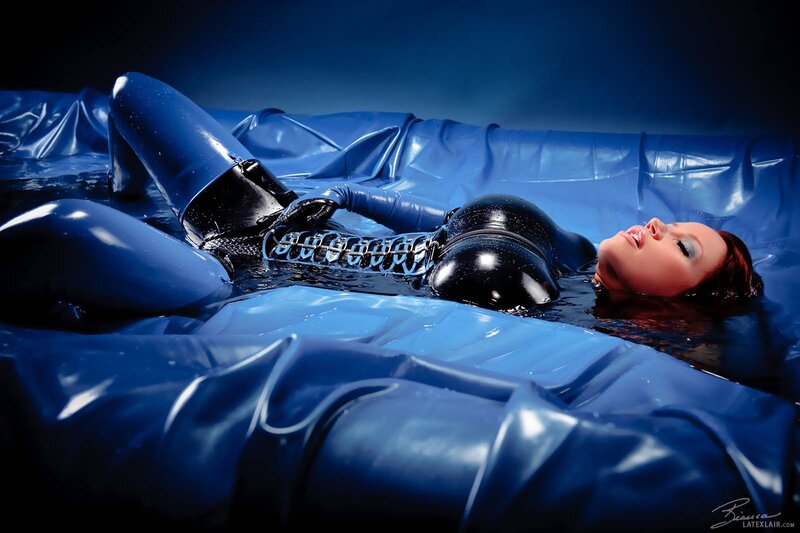 woman in latex suit floating