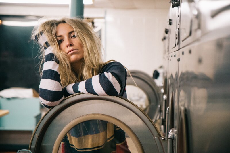 Woman in Laundry Room — White