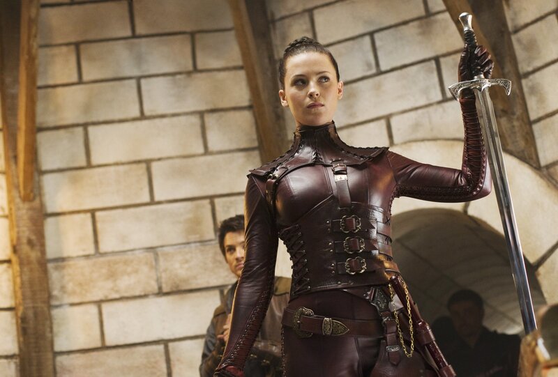 woman in leather armor holding sword