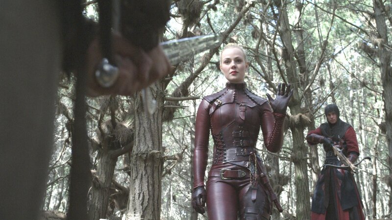woman in leather armor in forest