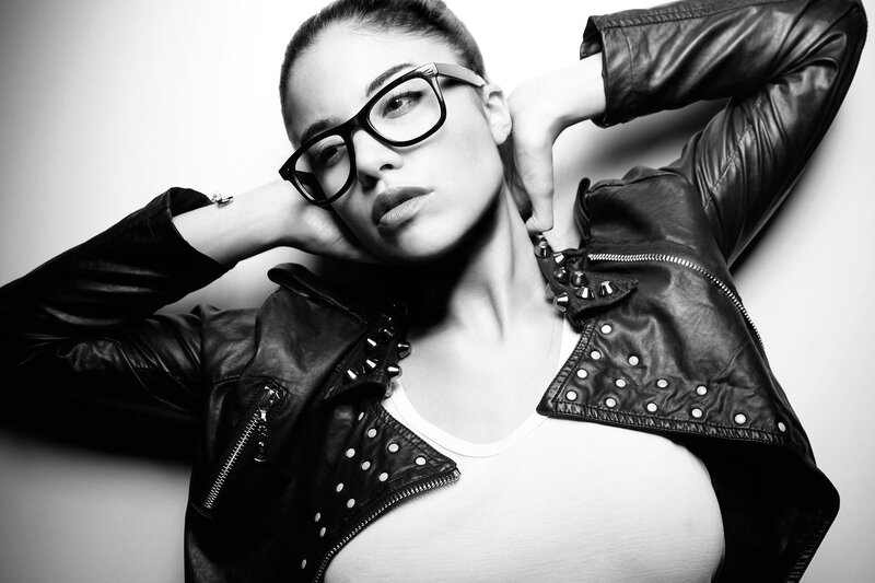 woman in leather jacket and glasses