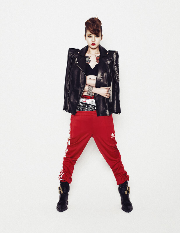 woman in leather jacket and red pants