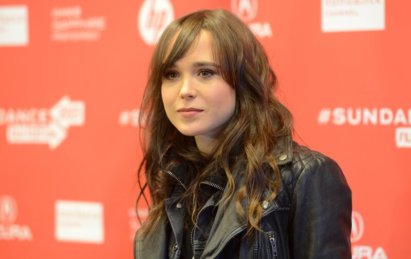 woman in leather jacket at event