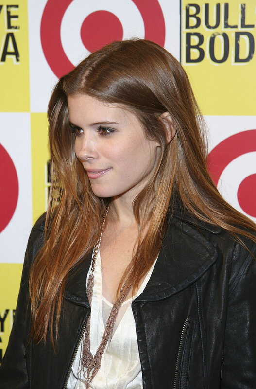 woman in leather jacket at event