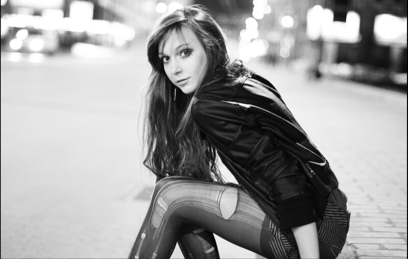 woman in leather jacket at night