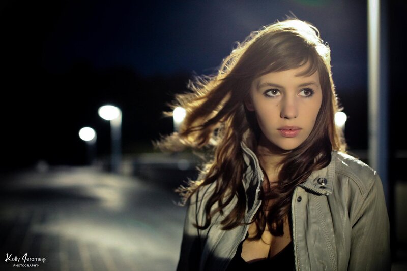 woman in leather jacket at night