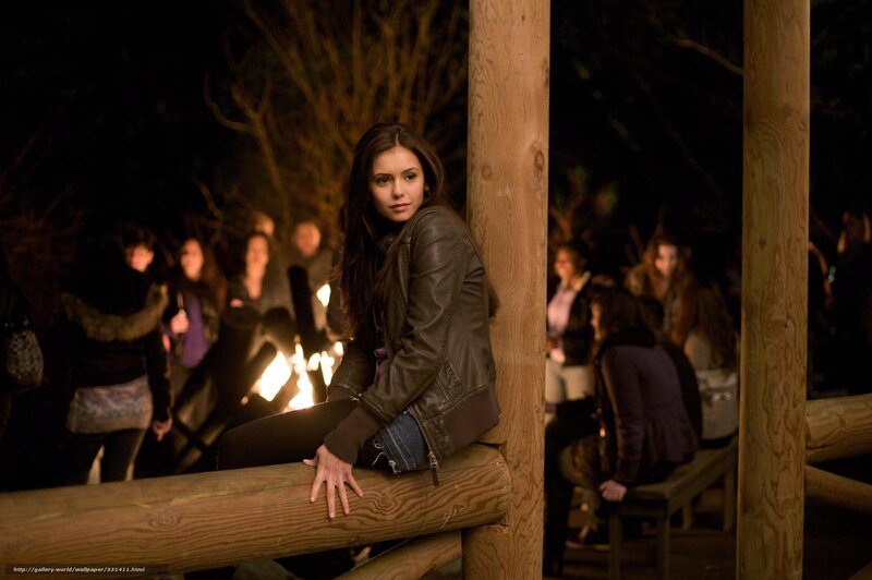 Woman in leather jacket at night