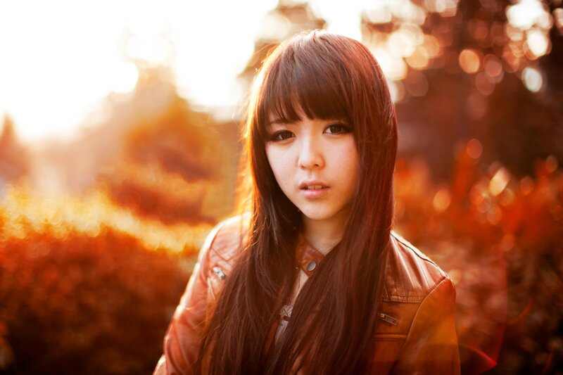 woman in leather jacket at sunset