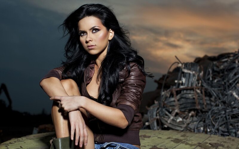 woman in leather jacket at sunset