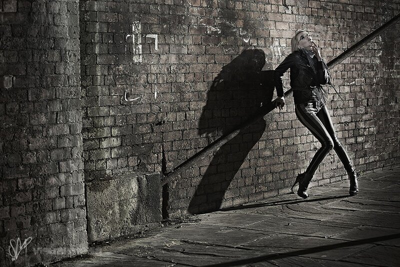 Woman in Leather Jacket — Black, Dramatic, Night, Photograph, Brick Wall