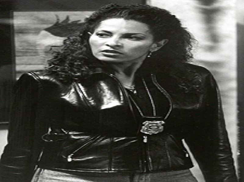 Woman in Leather Jacket — Black, Serious, Photograph, Leather Jacket, Badge