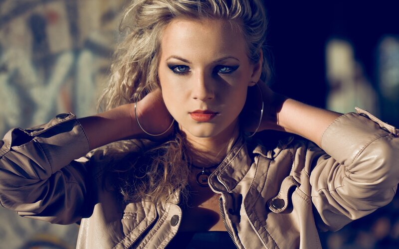 Woman in Leather Jacket — Brown, Dramatic, Photograph, Hoop Earrings