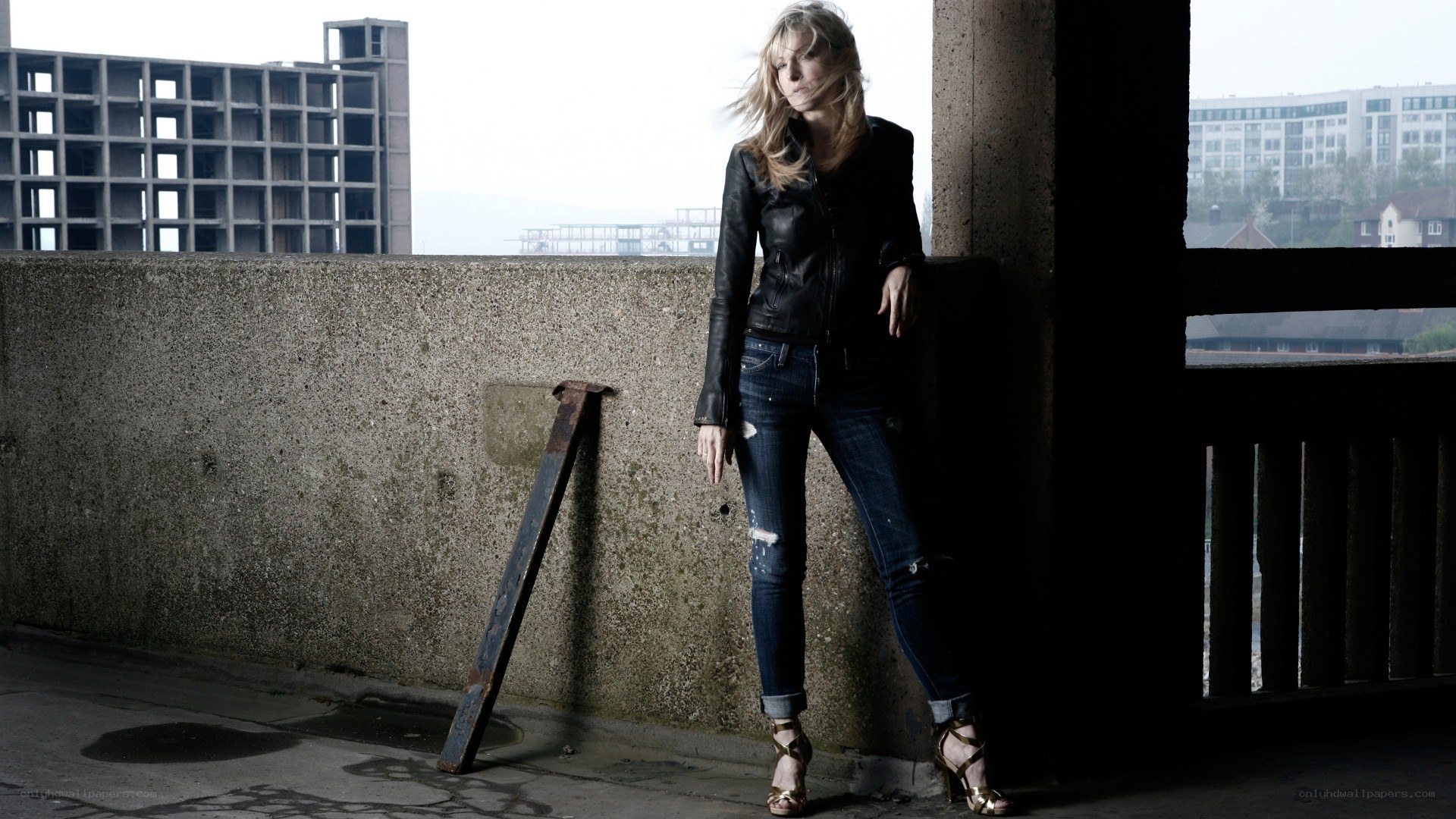 woman in leather jacket leaning