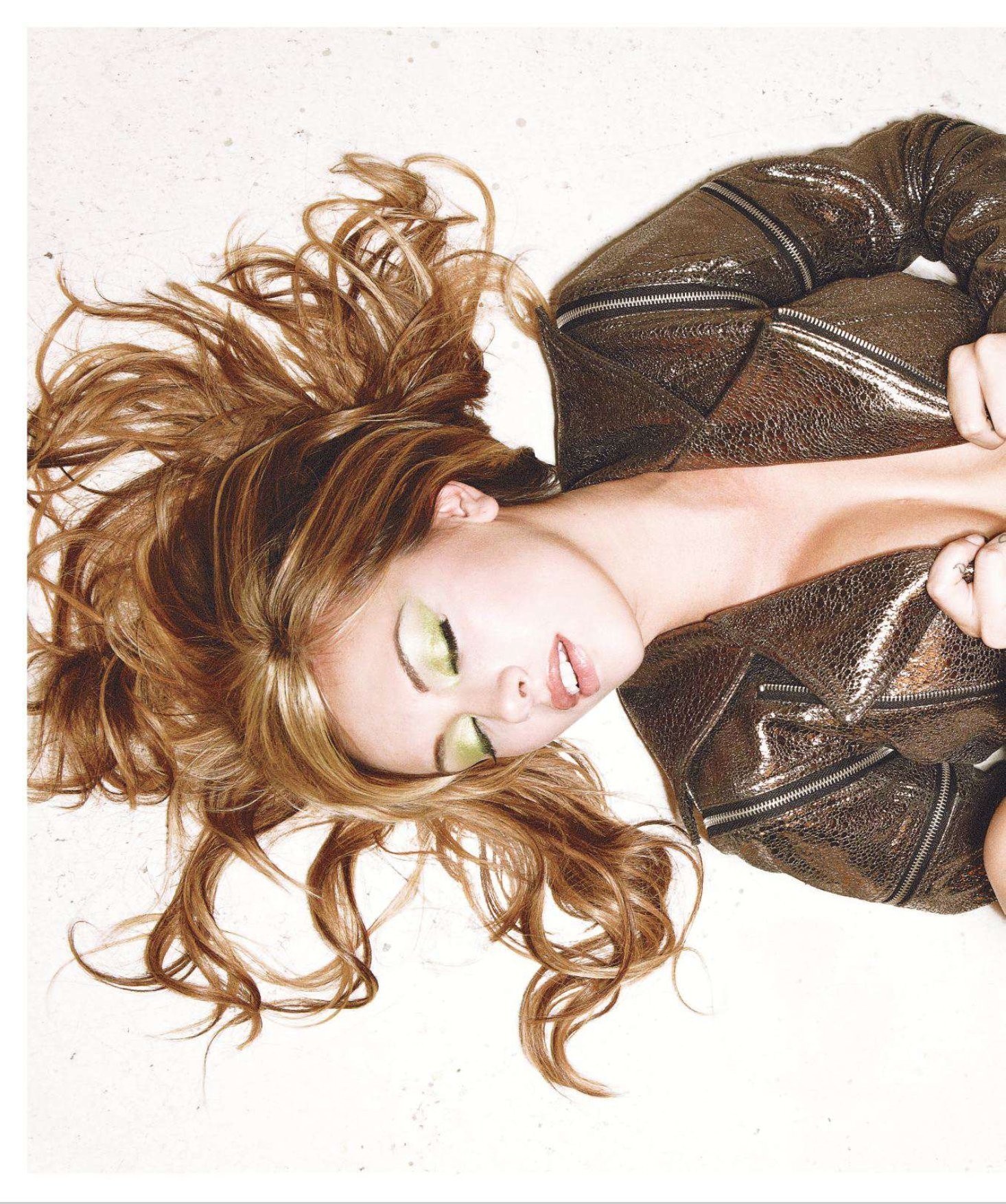 woman in leather jacket lying down
