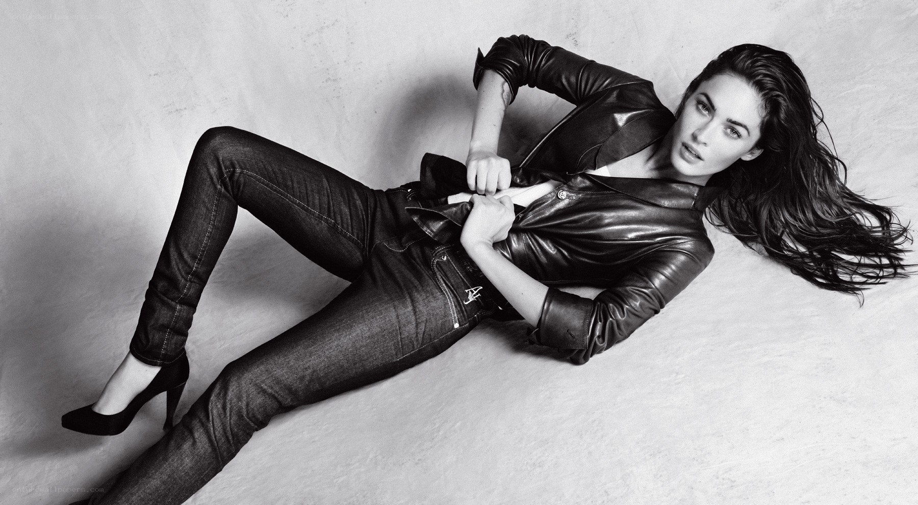woman in leather jacket lying down