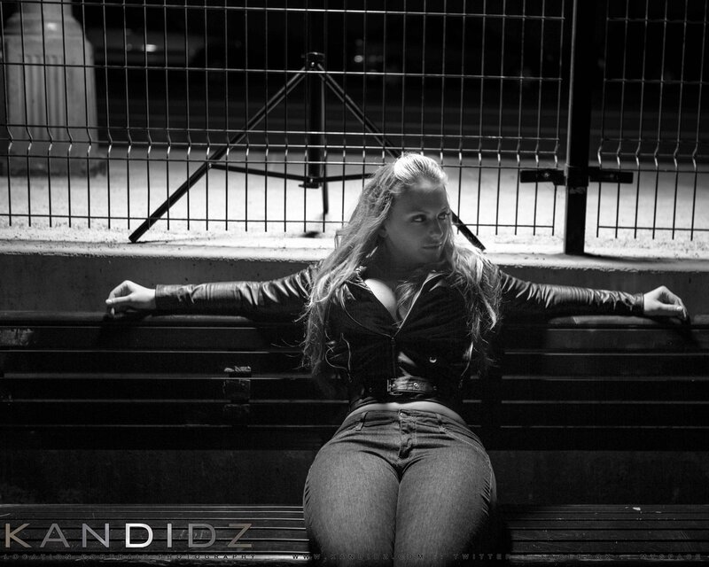 woman in leather jacket on bench