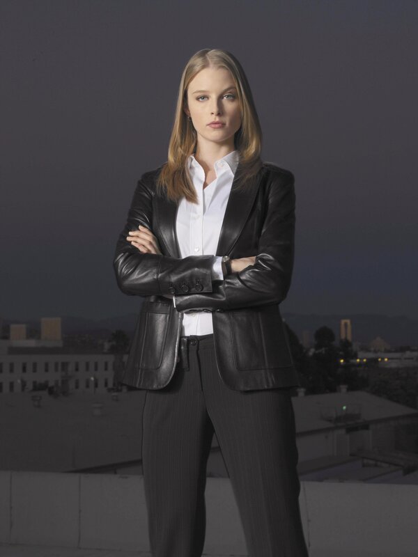 woman in leather jacket on rooftop