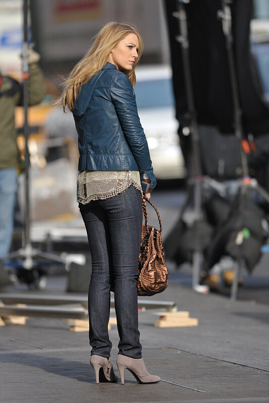 woman in leather jacket on set