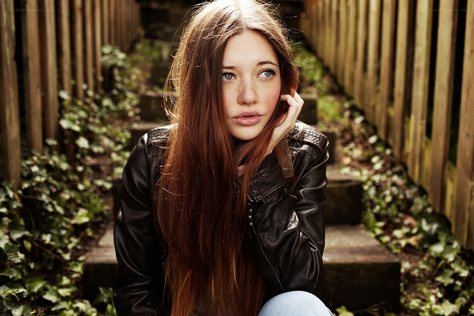 woman in leather jacket on steps