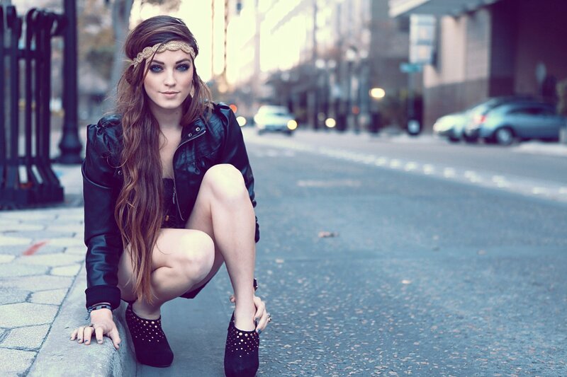woman in leather jacket on street