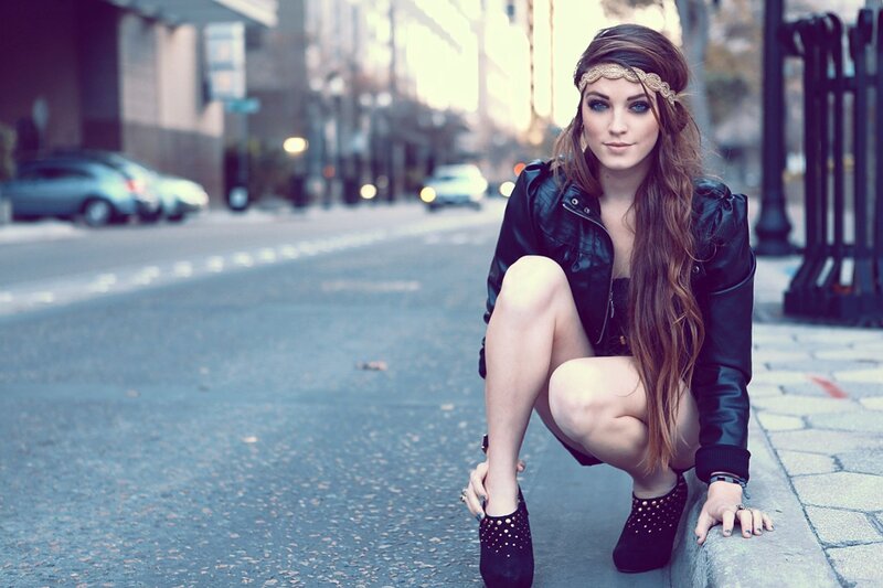 woman in leather jacket on street