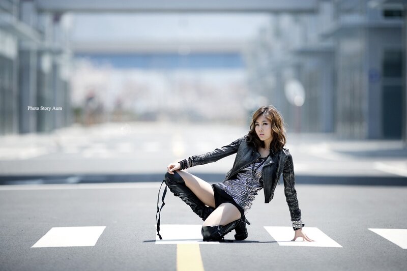 woman in leather jacket on street