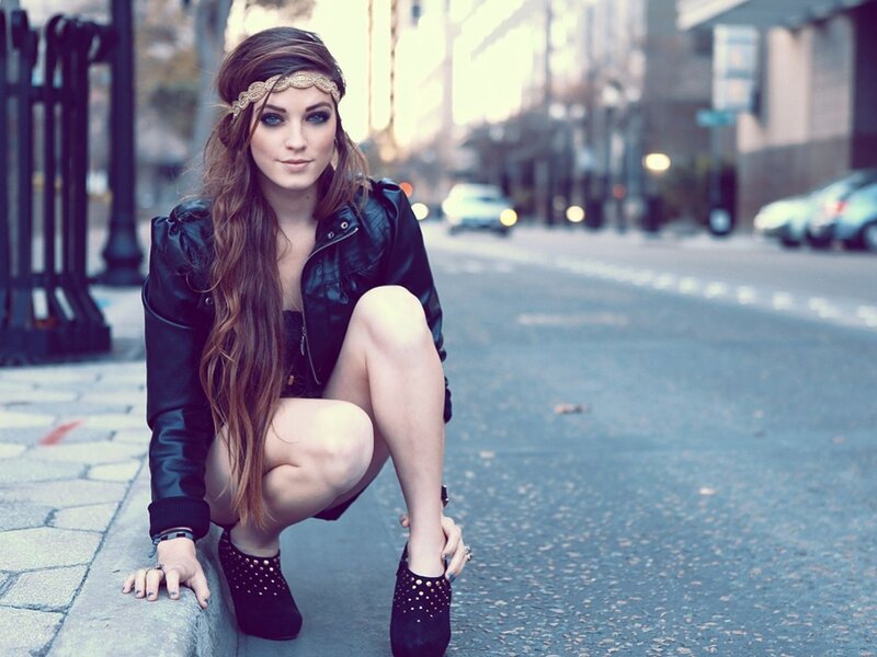 woman in leather jacket on street