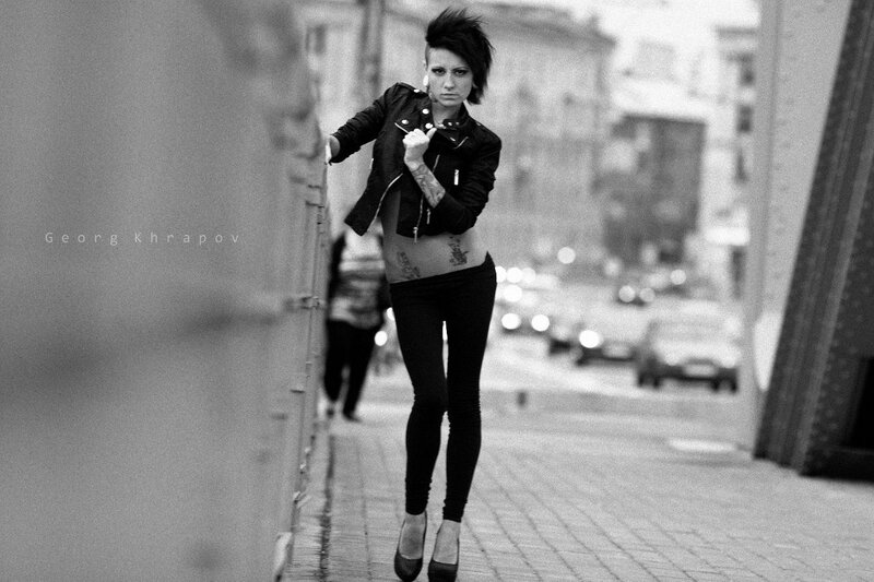 woman in leather jacket on street