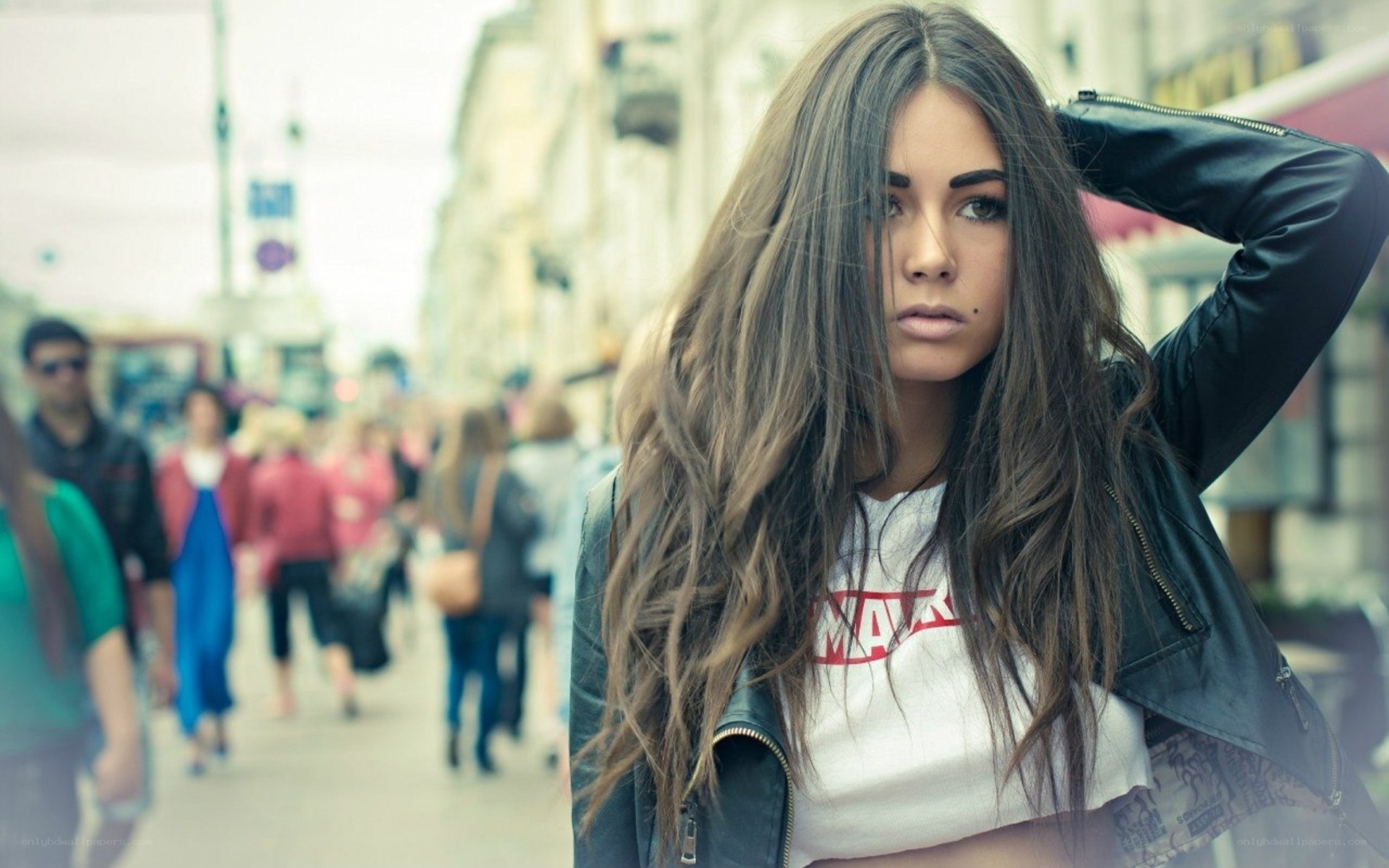 woman in leather jacket on street