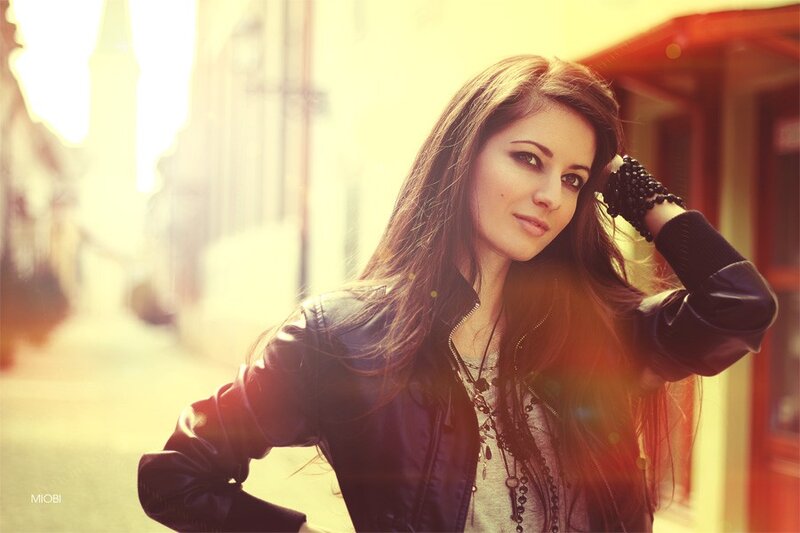 woman in leather jacket on street