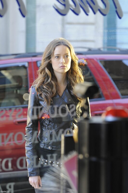 woman in leather jacket on street