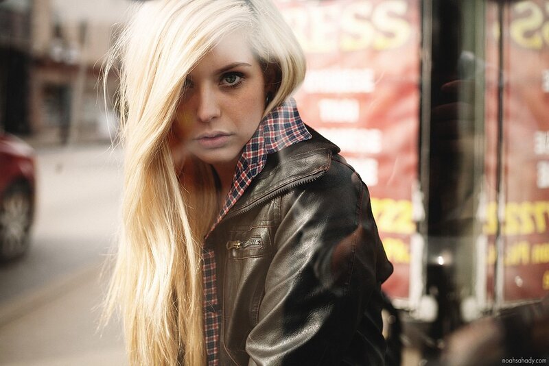 woman in leather jacket on street