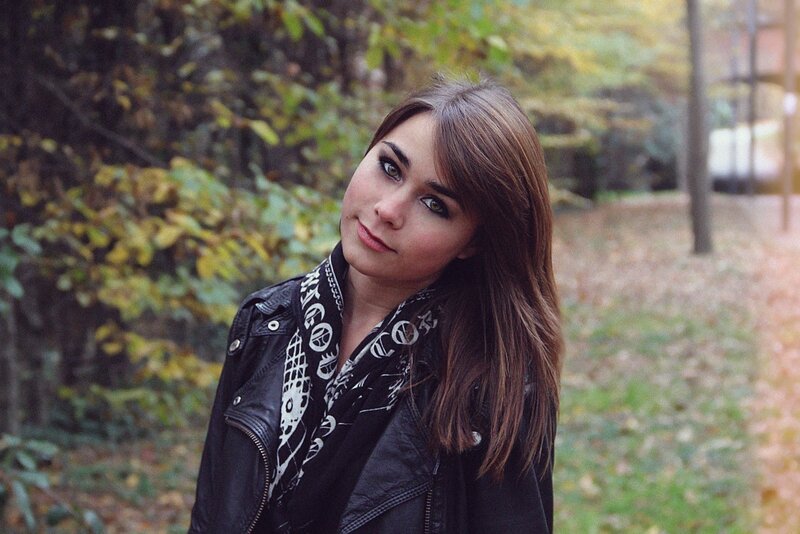woman in leather jacket outdoors