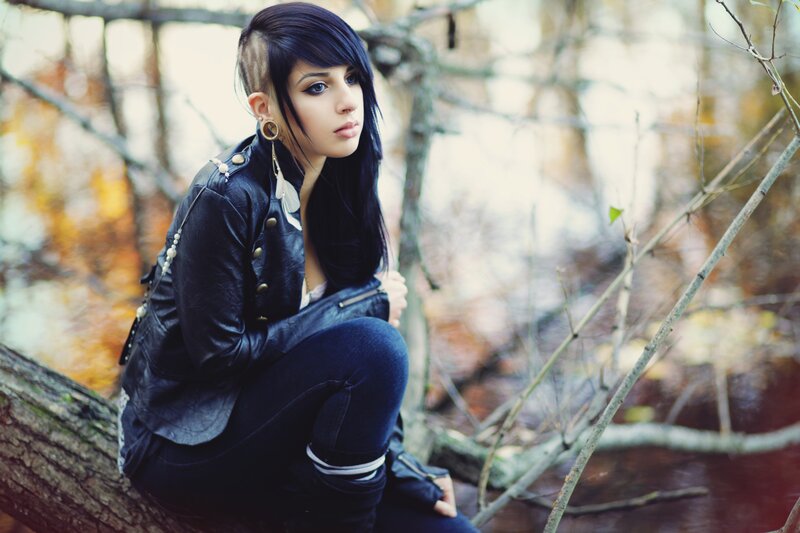 woman in leather jacket outdoors