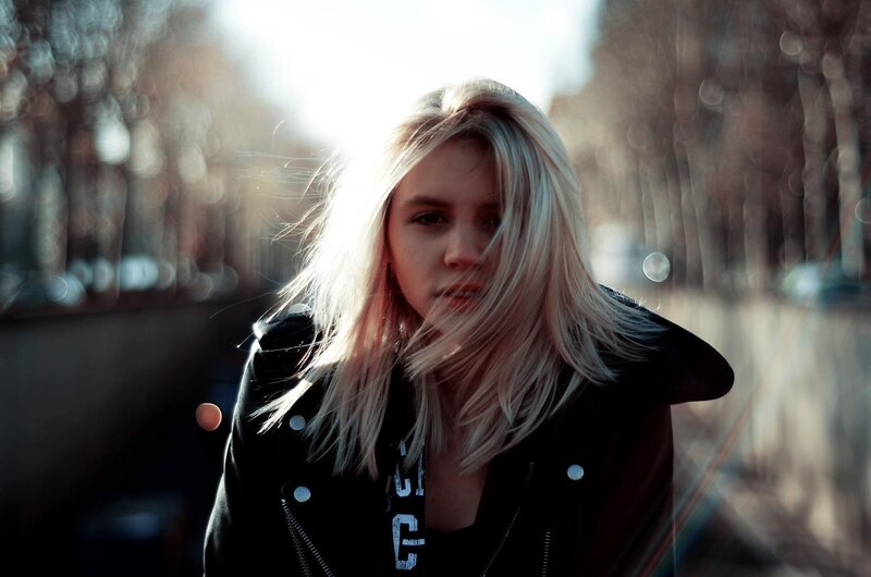 woman in leather jacket outdoors