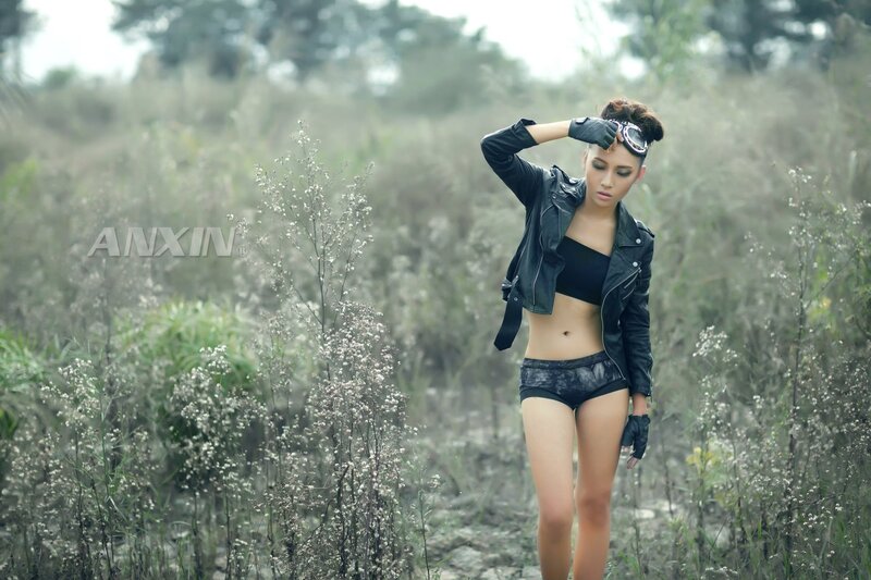 woman in leather jacket outdoors
