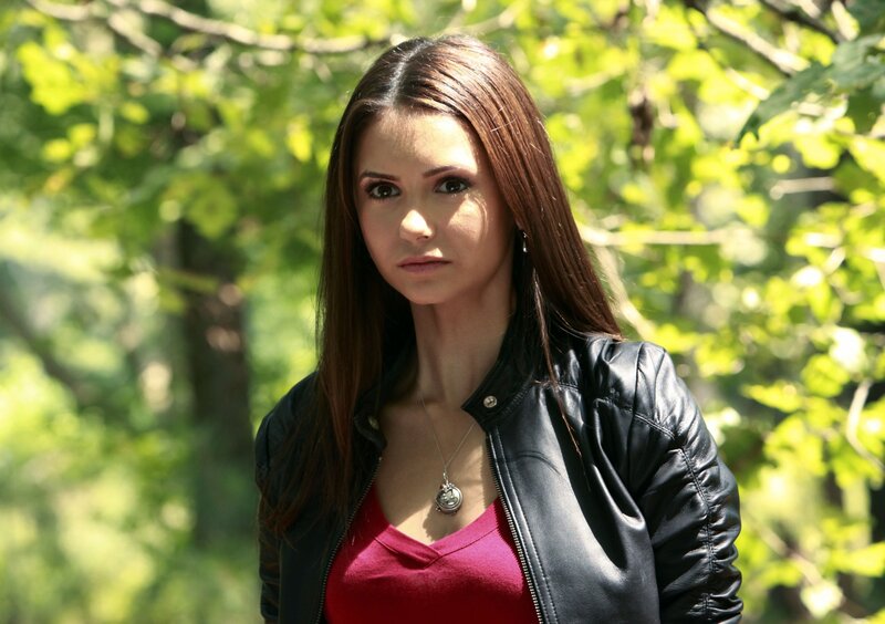 woman in leather jacket outdoors