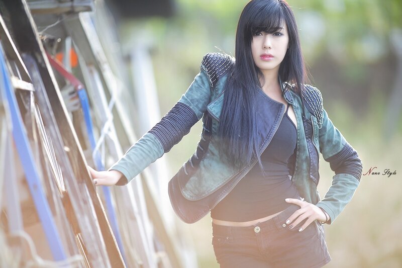 woman in leather jacket outdoors