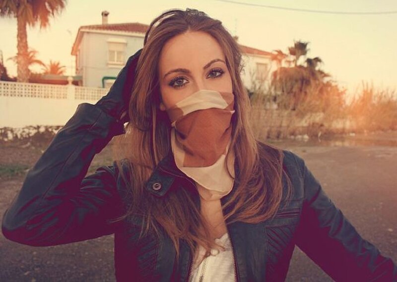 woman in leather jacket outdoors