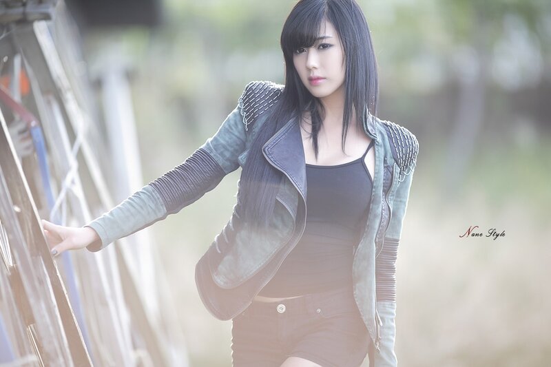 woman in leather jacket outdoors
