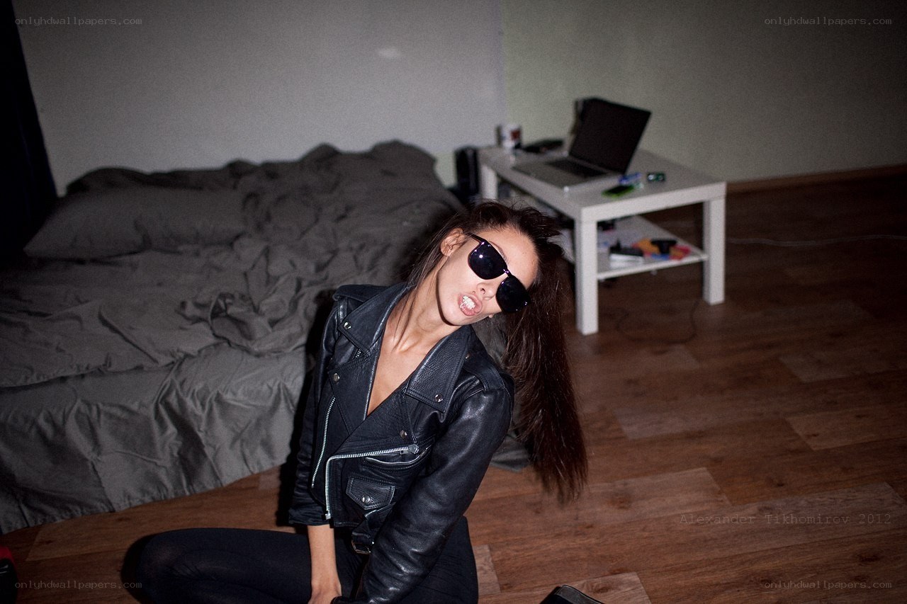 woman in leather jacket posing
