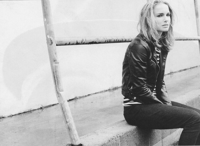 woman in leather jacket sitting